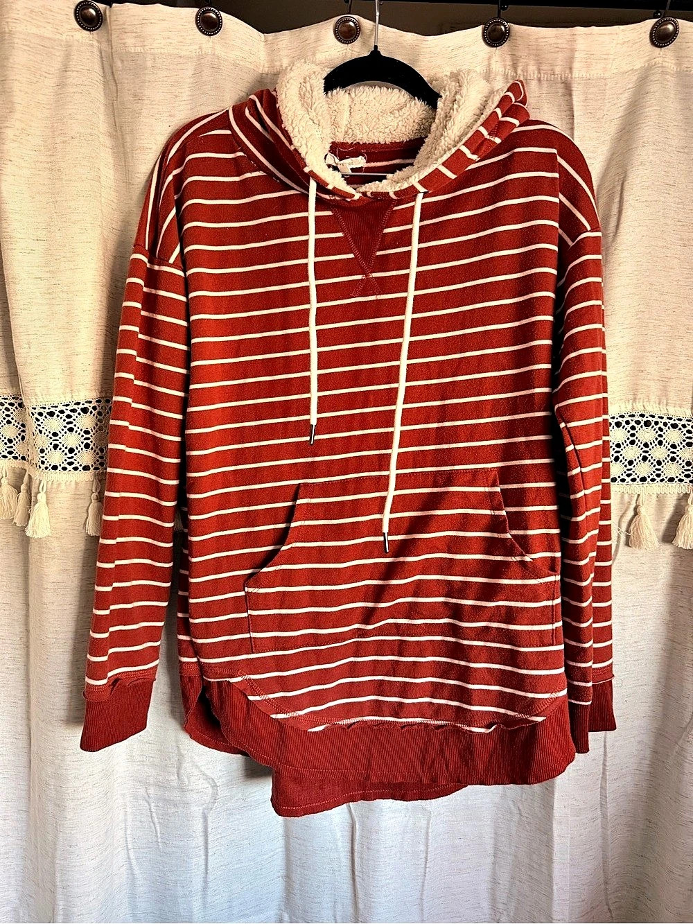 Maurice’s rust orange and white hoodie